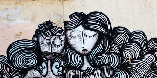 Abstrakte Graffitidarstellung einer Frau und eines Mannes